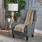 Sillón decorativo de respaldo alto con orejas y patas de madera de abedul