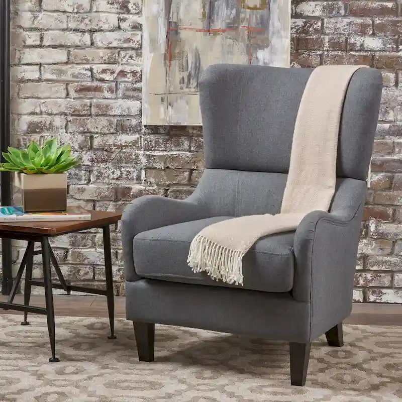 Sillón decorativo de respaldo alto con orejas y patas de madera de abedul