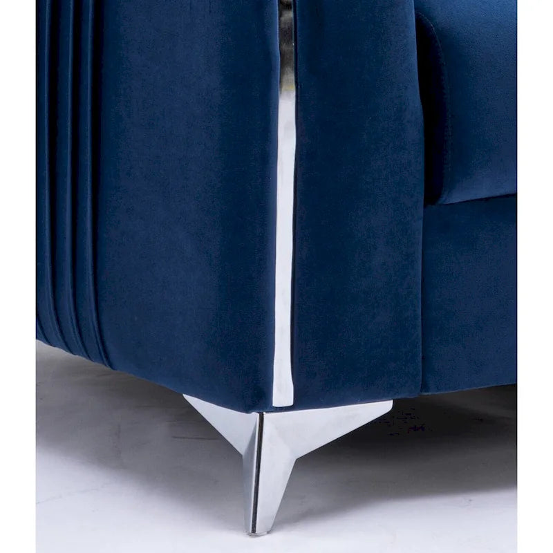 Sillón decorativo de terciopelo azul con ribete cromado y reposabrazos plisados verticales